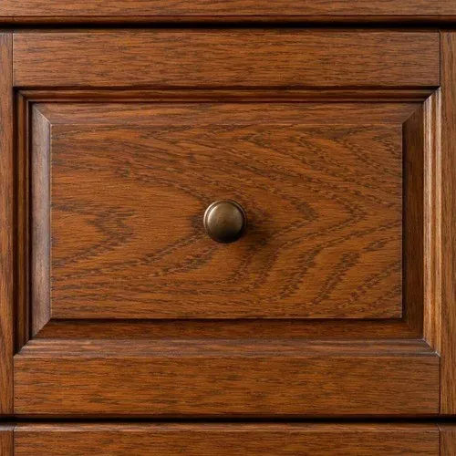 Restored rich wood grain on a refinished cabinet drawer front